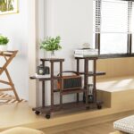 Porta Piante da Esterno, Scaffale Portafiori a 4 Livelli, Fioriera da Esterno e Interno in Legno con 4 Ruote, 123,5 x 33 x 80cm - immagine 9